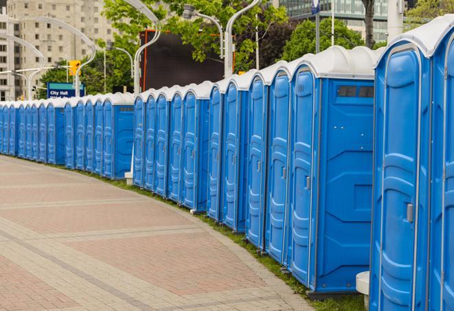 a row of portable restrooms at a fairground, offering visitors a clean and hassle-free experience in Highland Lakes